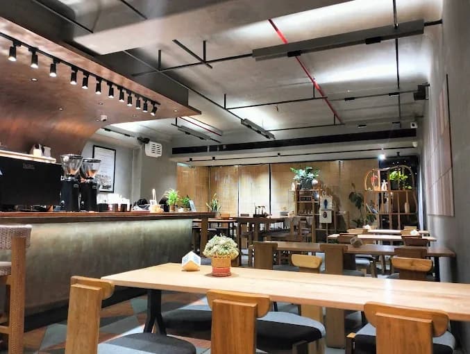 Cafe 9 Story — Pragati IT Park — interior seating and espresso bar